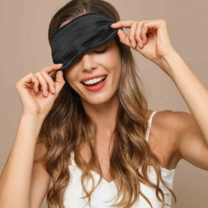 Promeed mulberry silk sleep mask with 3D contoured cups shown beside a pair of foam earplugs