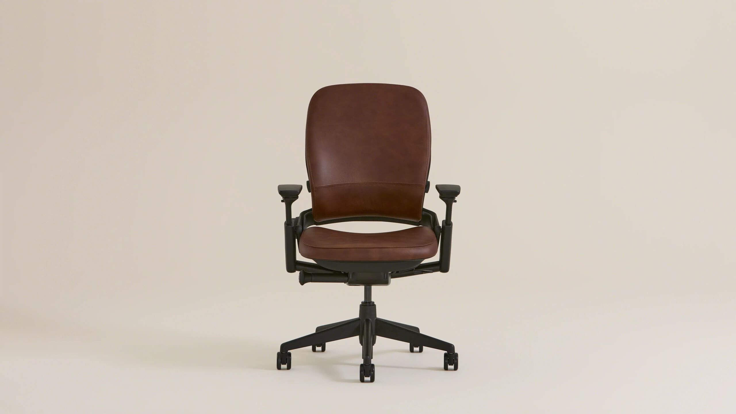 Steelcase Leap V2 ergonomic office chair shown from the side with adjustable lumbar support and armrests — view 5