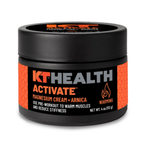 4 fl oz jar of KT Tape Activate warming magnesium cream with Arnica Montana