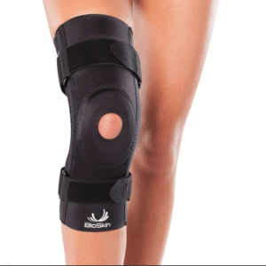 BioSkin patella stabilizer knee brace with foam ring and side support worn on a bent knee