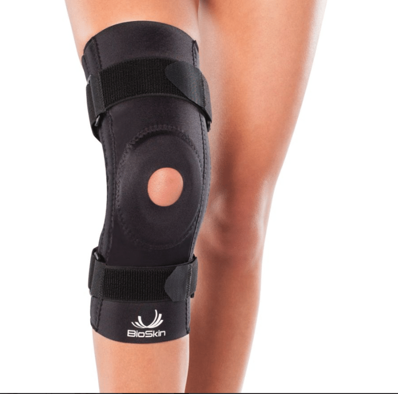 BioSkin patella stabilizer knee brace with foam ring and side support worn on a bent knee
