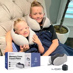 iReliev memory foam travel pillow curved to cradle the neck, shown from the side