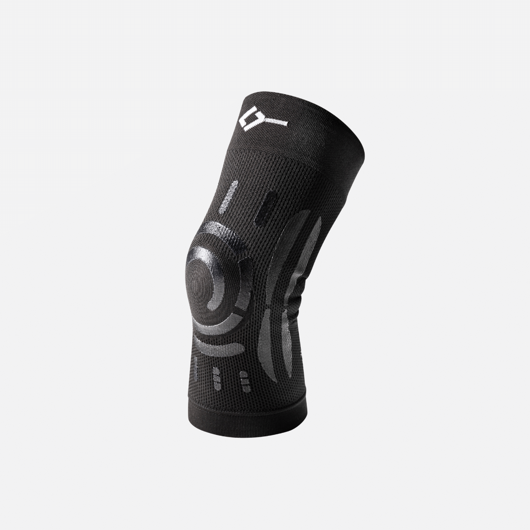 Black Floky compression knee brace in size L-XL for the right knee, shown flat with silicone support bands