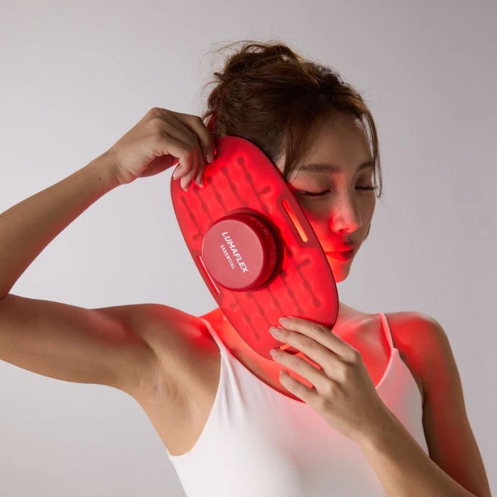 Lumaflex Essential red light therapy wrap, a flexible infrared LED band shown wrapped around a knee — view 4