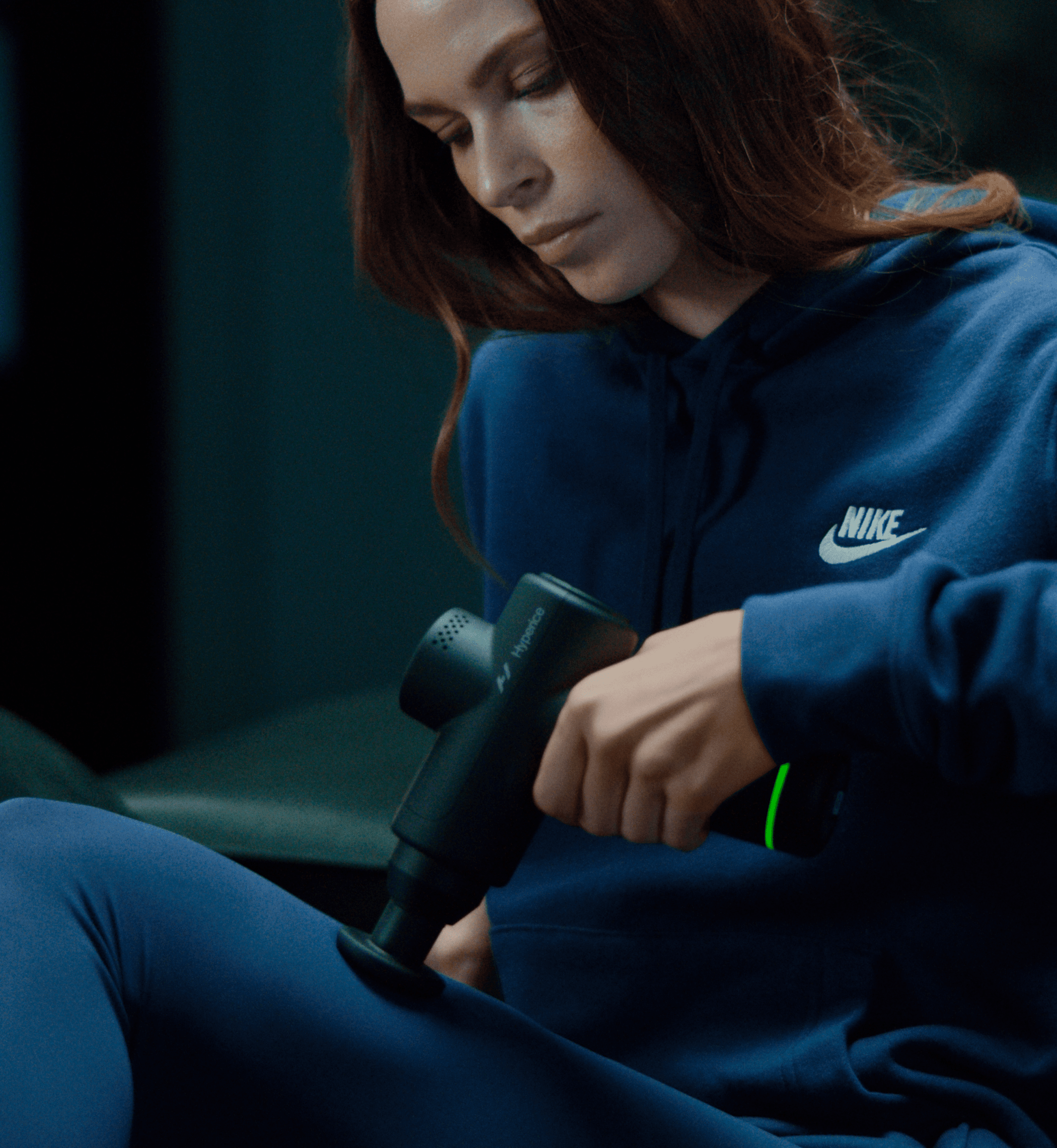 Hyperice Hypervolt Go 2 portable percussion massager held in one hand — view 4