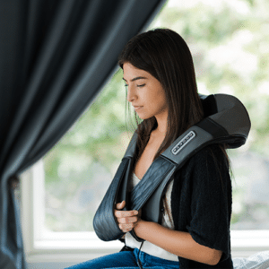 iReliev shiatsu neck massager resting over the shoulders and upper back