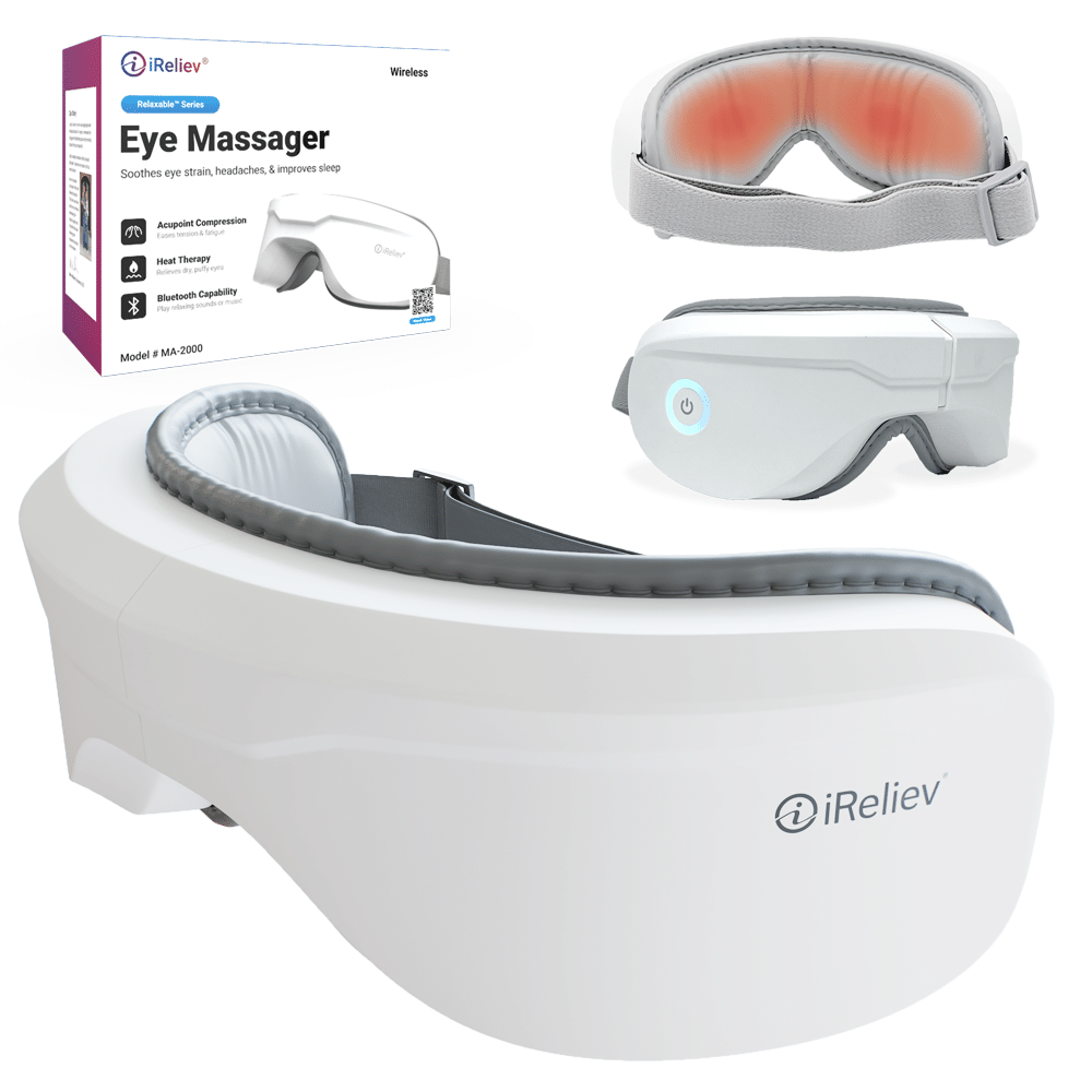 iReliev heated eye massager resting beside its matching neck pillow — view 2