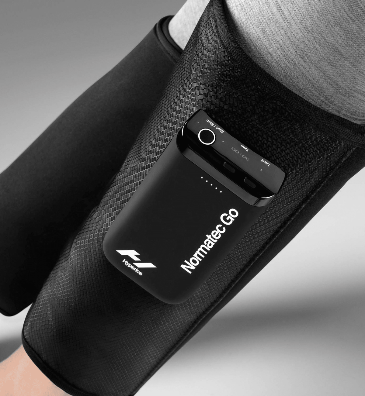 Hyperice Normatec Go portable calf compression wraps worn on both calves — view 2