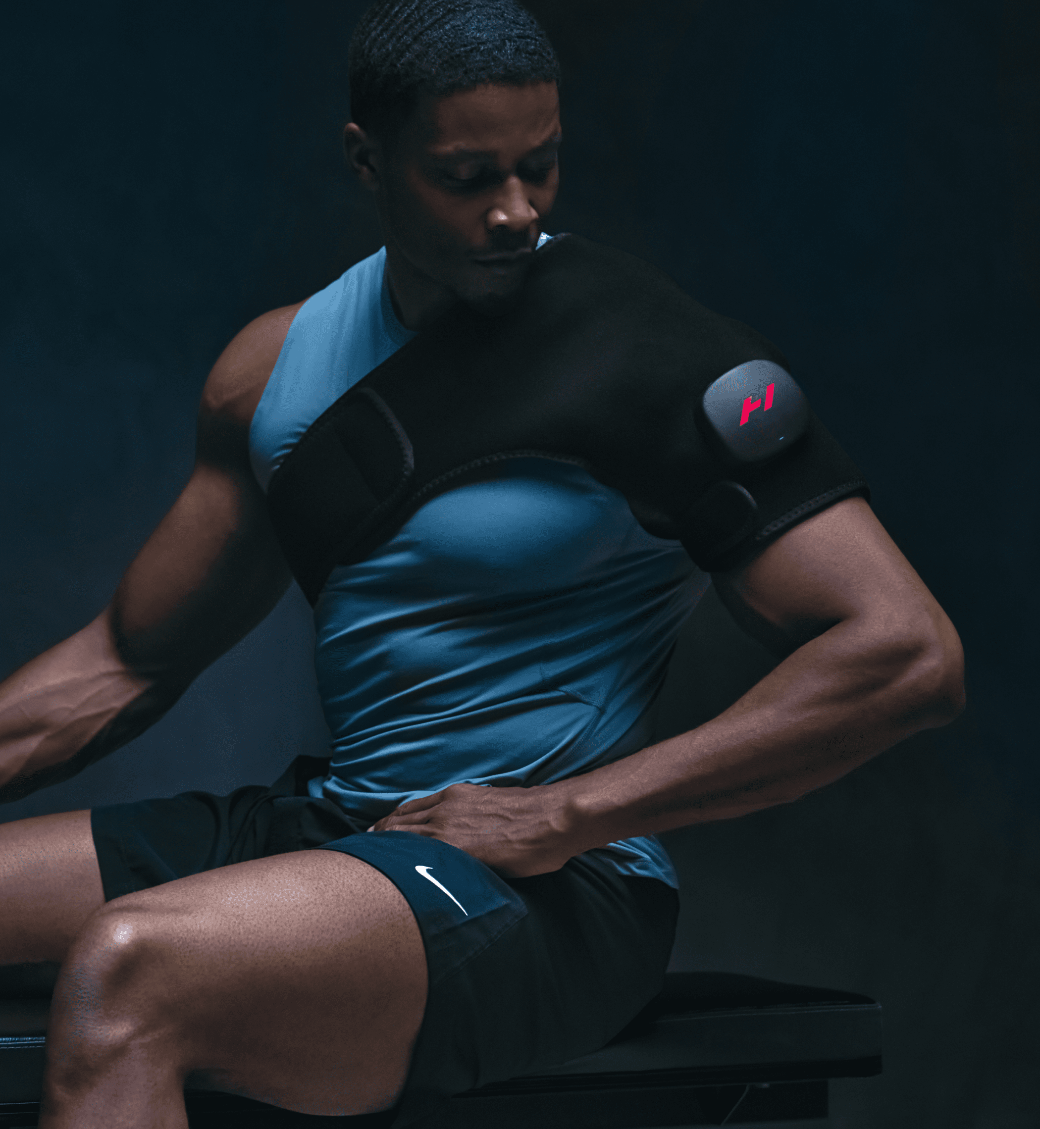 Hyperice Venom 2 heated shoulder massager neoprene wrap worn over the shoulder — view 5