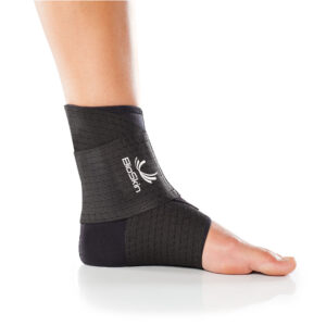 BioSkin extra-small ankle compression sleeve with adjustable wrap and gel padding