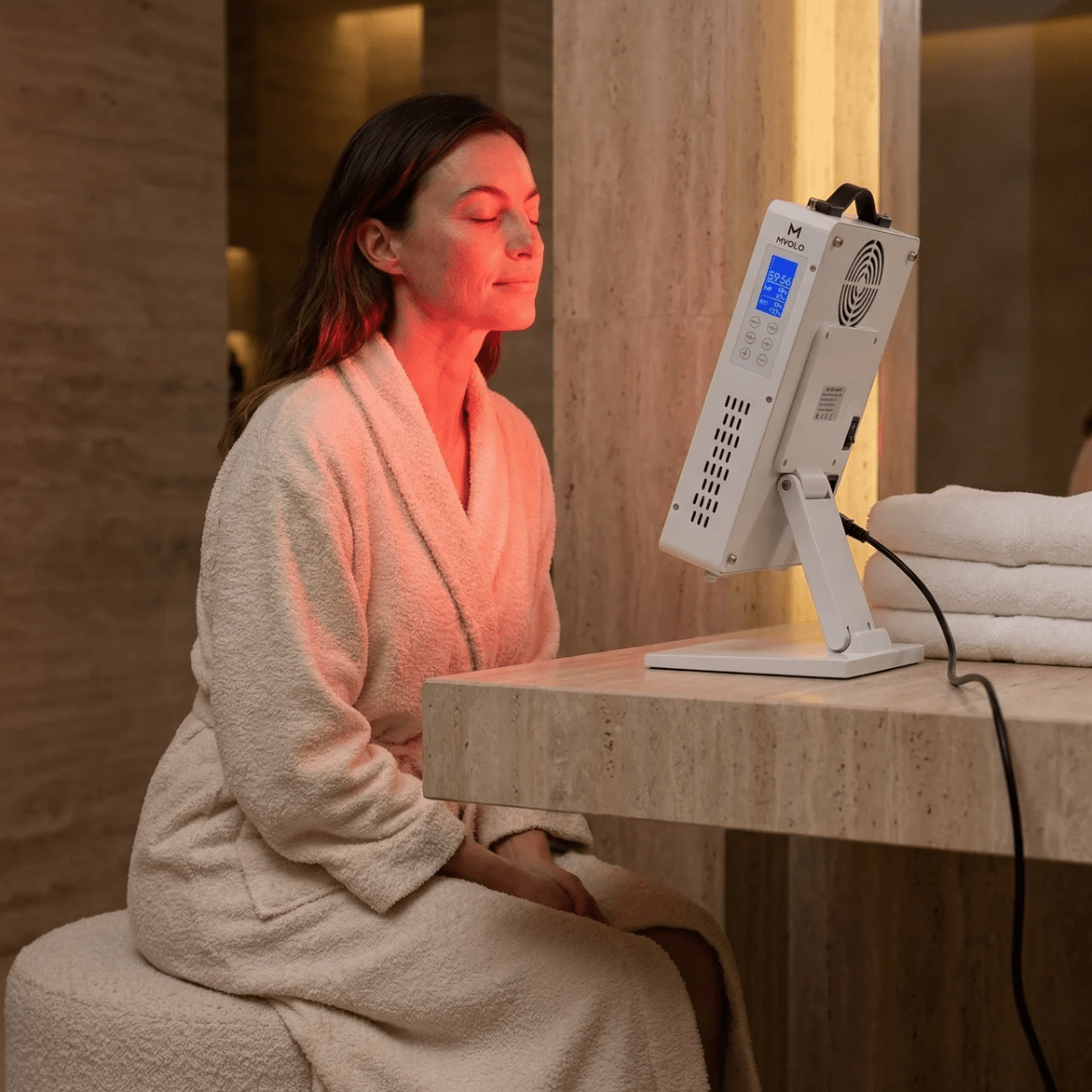 Mvolo Elite Series 306 red light panel standing on a table with its remote — view 2