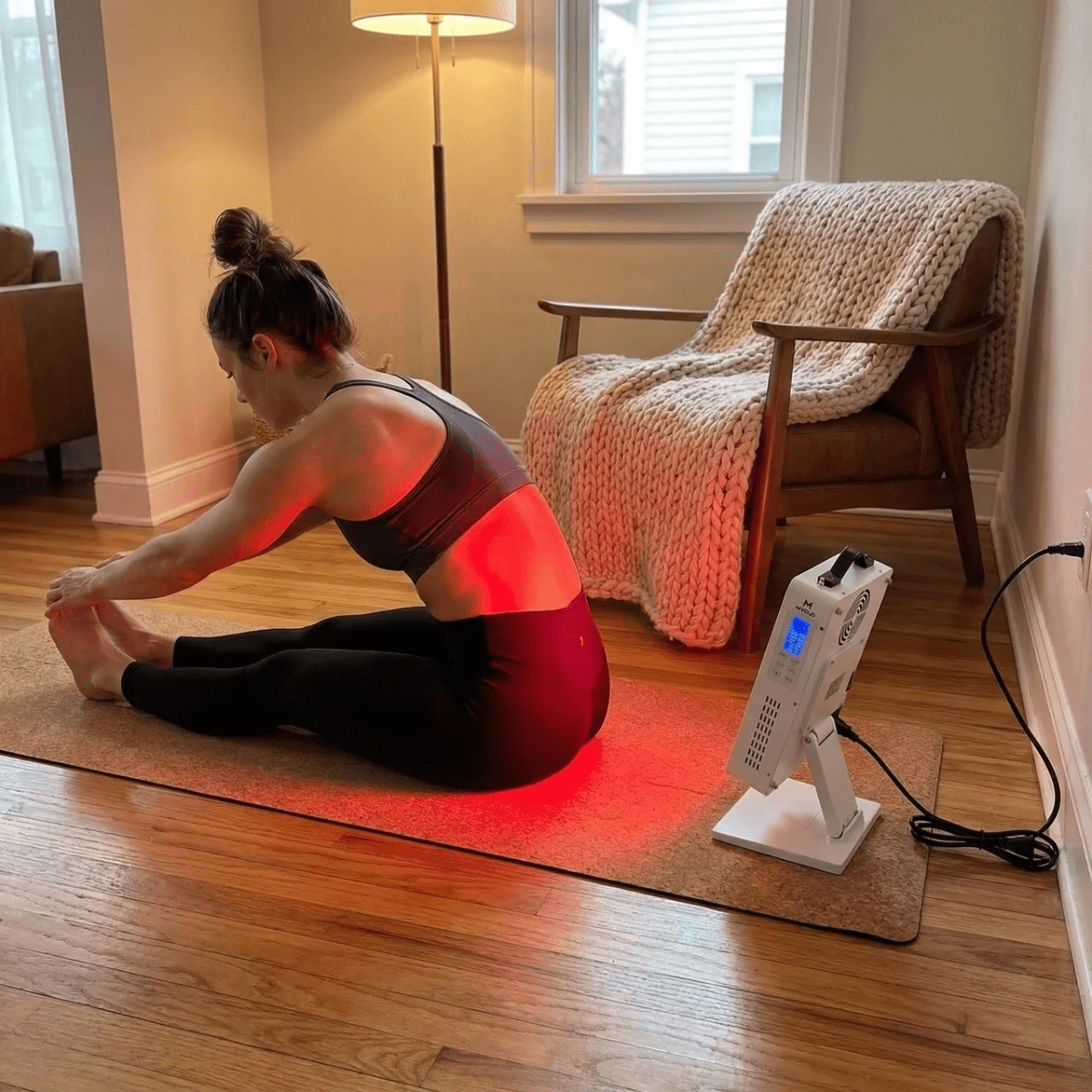 Mvolo Elite Series 306 red light panel standing on a table with its remote — view 3