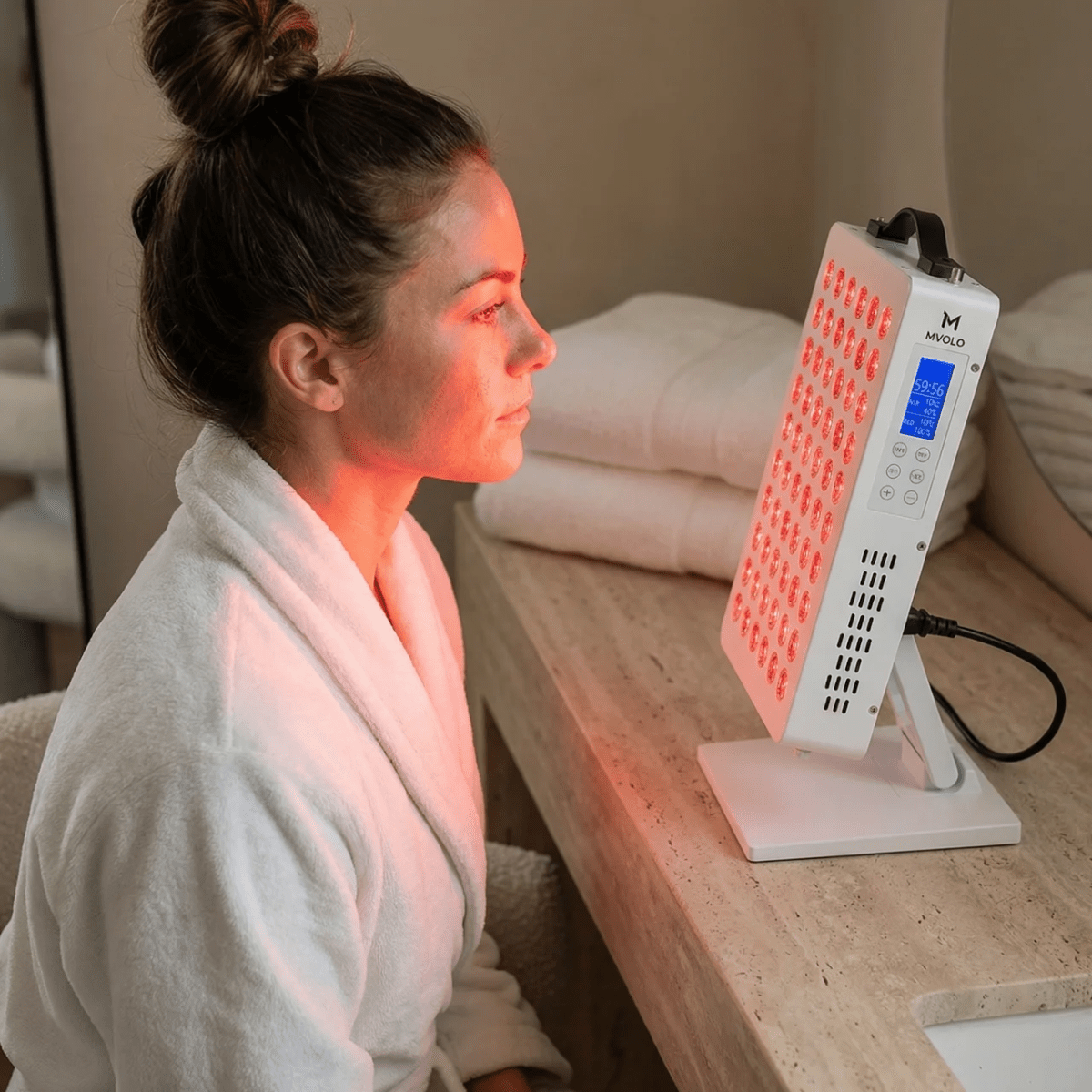 Mvolo Elite Series 306 red light panel standing on a table with its remote — view 5