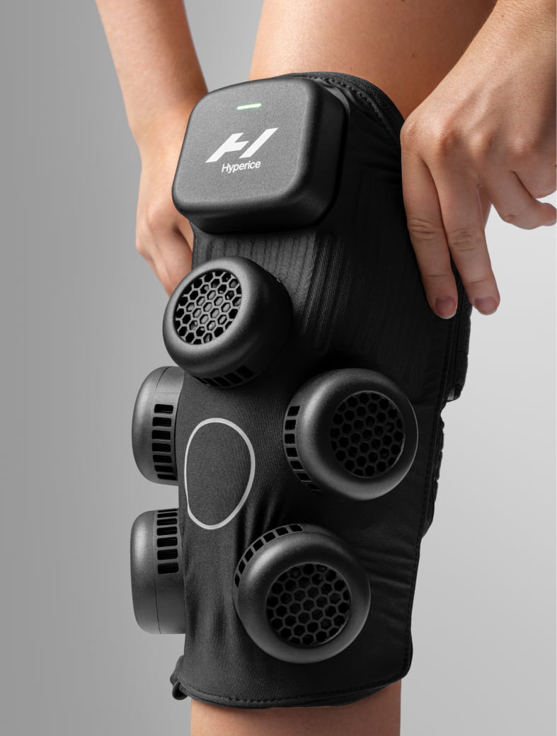 Hyperice X contrast therapy knee wrap fitted around a bent knee — view 4