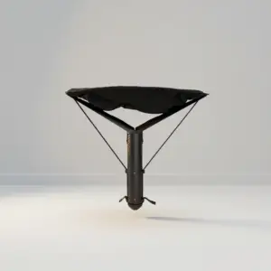 Sitpack ZEN X portable folding stool in all black, shown folded and set up for sitting