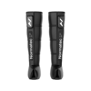 Hyperice Normatec Elite leg compression boots worn on both legs with cordless control units attached