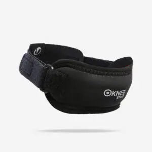 Decathlon knee support strap in smoked black, worn below the knee during a workout