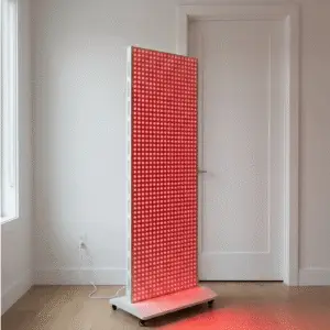 Mvolo Platinum Series 9000 red light therapy panel standing upright with its LED array lit