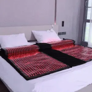 Mvolo red light therapy blanket unfolded, showing the red and near-infrared LED lining inside