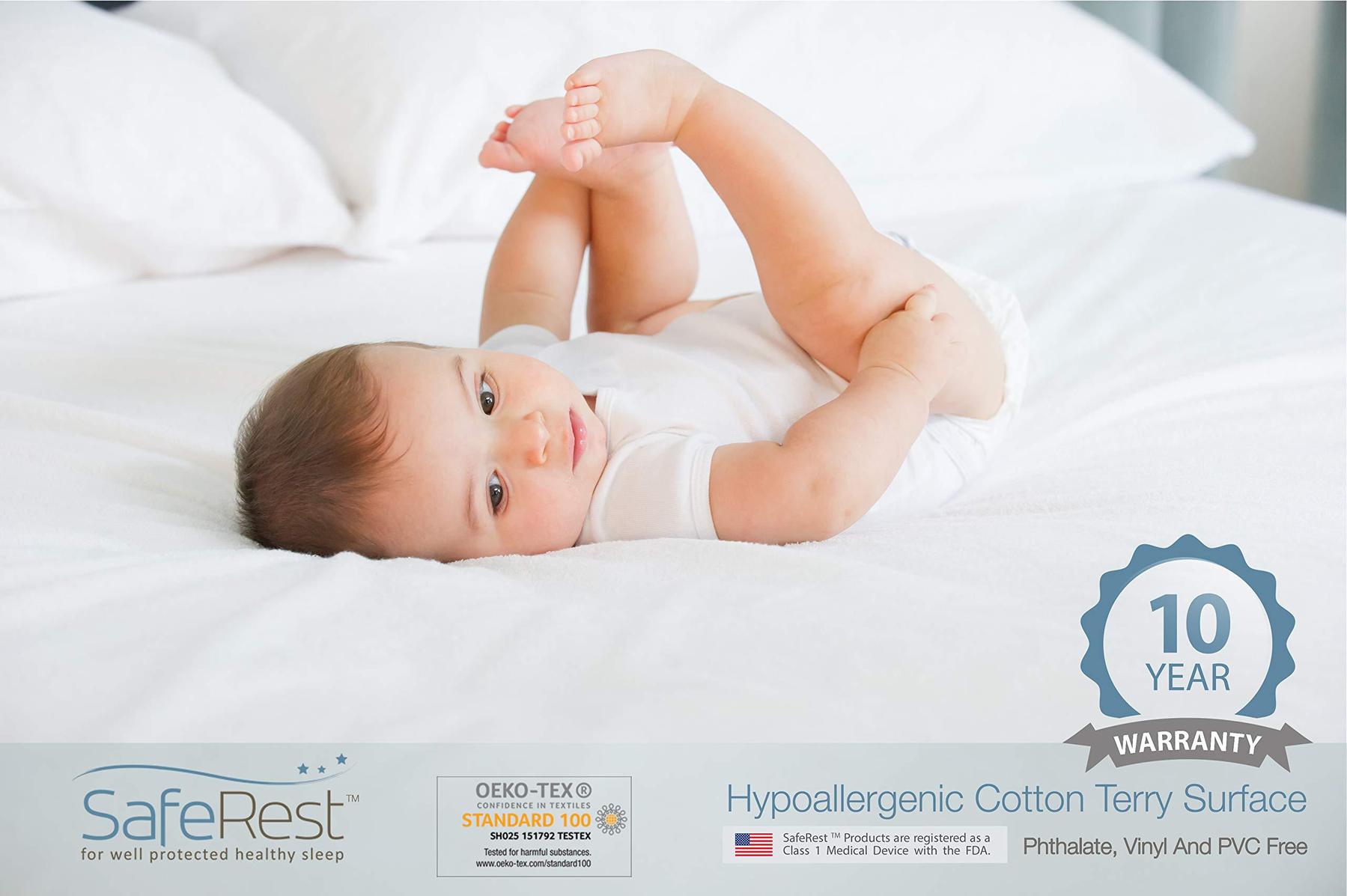 Baby lying on a bed made with the SafeRest cotton terry protector (maker image)