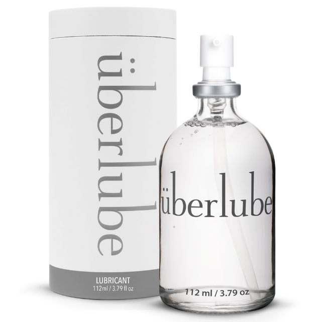 Überlube 112 ml glass bottle with pump next to its tube packaging